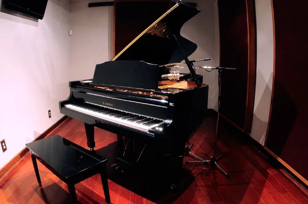 Nine-foot Kawai grand piano in its live room